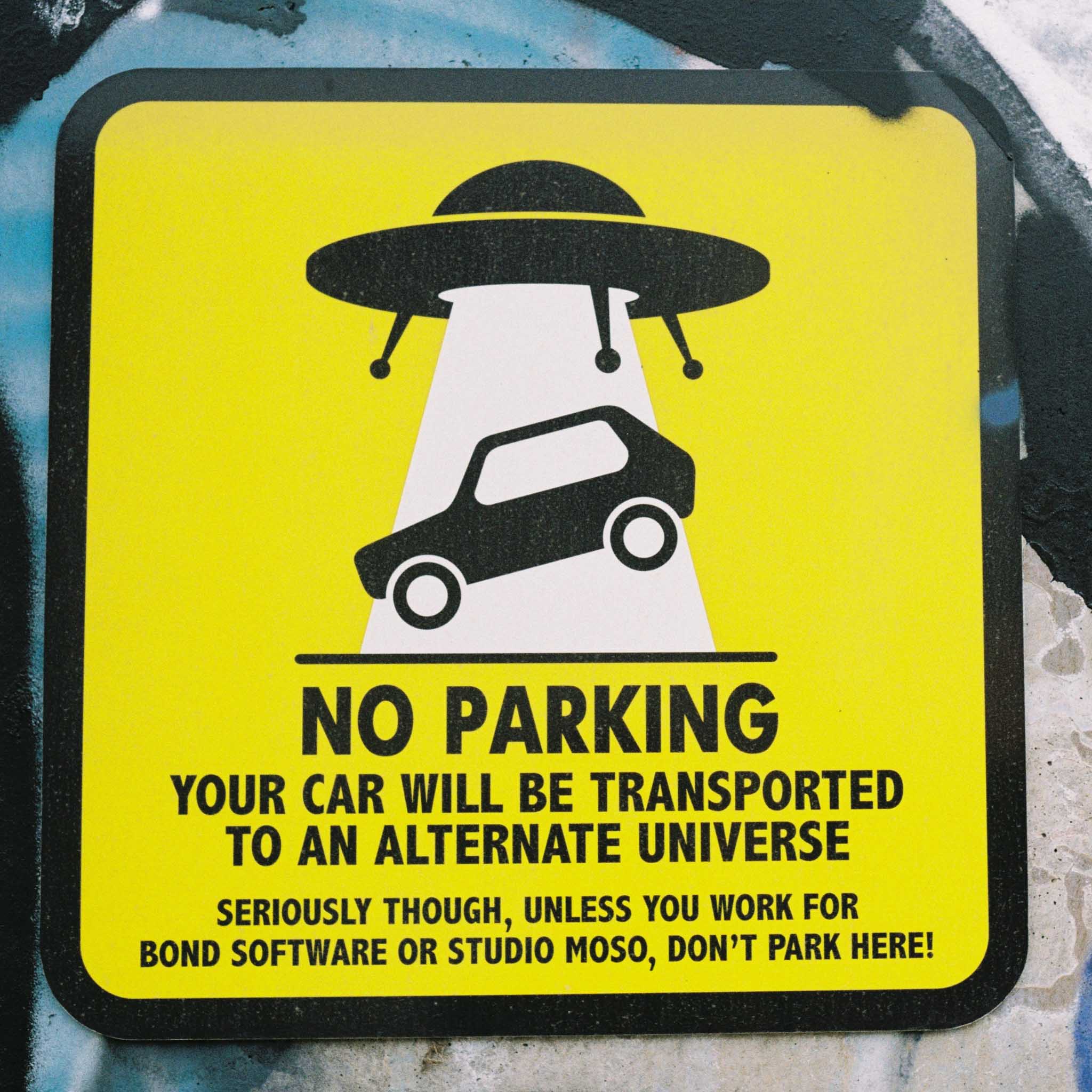 An amusing “no parking” sign that threatens to transport your car to another universe. Collingwood, Melbourne